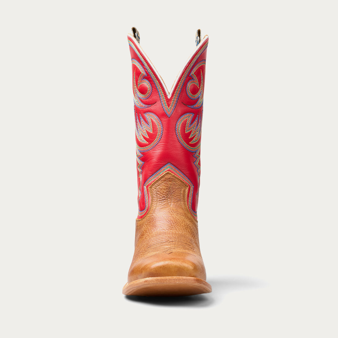 Cowboy boot with red top and brown bottom on a white background