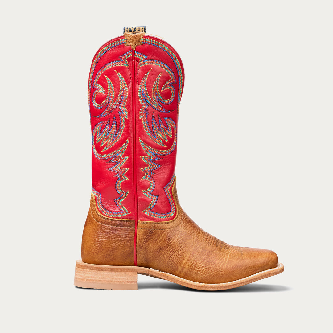 Brown cowboy boot with red upper on a white background