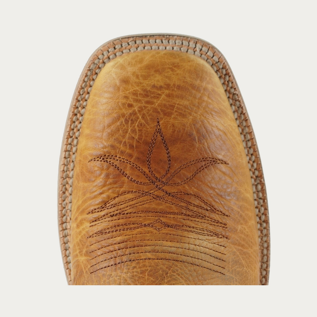 Close up of toe of brown cowboy boot