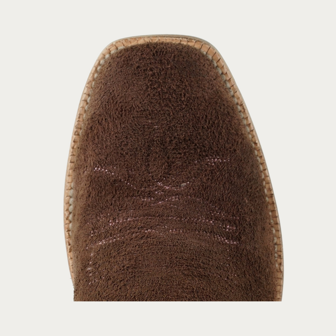 Toe of brown rough out leather cowboy boot